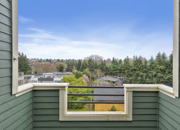 the view of the city from the balcony of a home