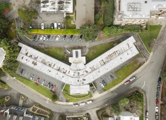 an aerial view of a building with a round road