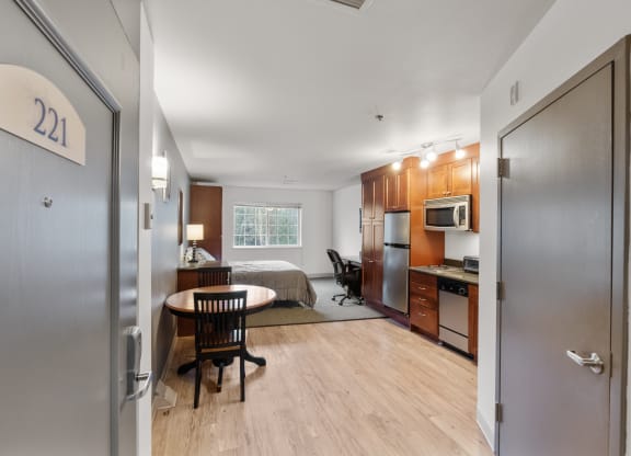 an apartment with a bedroom and a kitchen and a living room