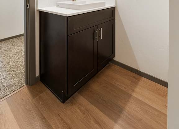 A bathroom with a sink and a mirror.