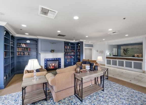 a living room with a couch and a fireplace