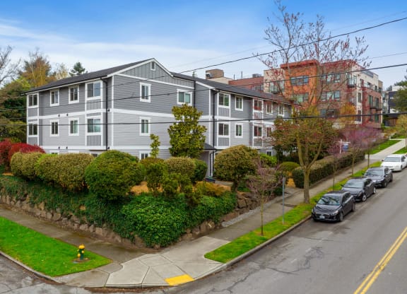 an aerial view of an apartment building on a city street