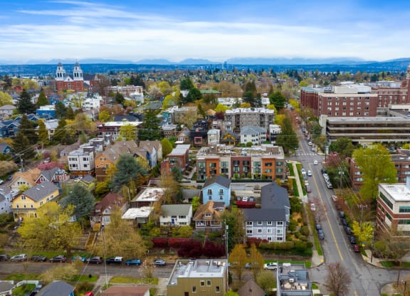 an aerial view of a city with buildings and trees