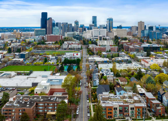 an aerial view of the city with the city skyline in the background