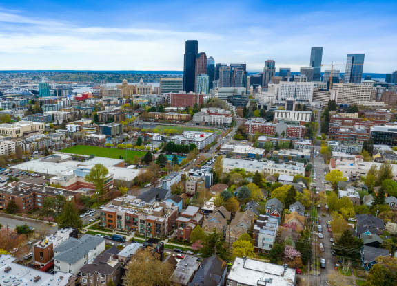 an aerial view of the city with the skyline in the background