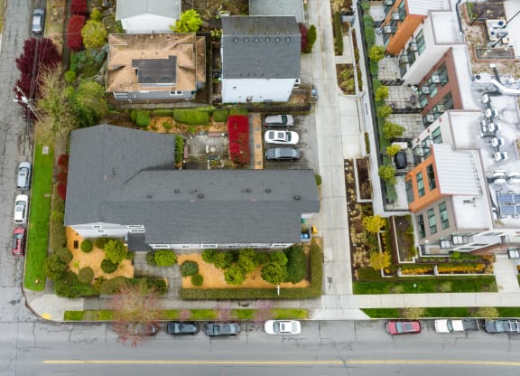 a birds eye view of a neighborhood with houses and a parking lot