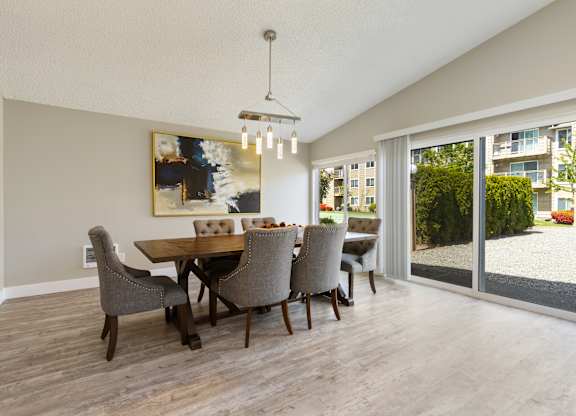 Community Club House with table and chairs and wood plank flooring