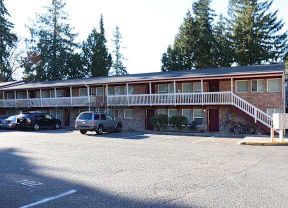 Horizon Park apartments parking lot view showing 2-story building , stairs and mailboxes