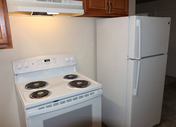 White refrigerator, stove and oven in 2-bedroom apartment home at Horizon Park Apartments