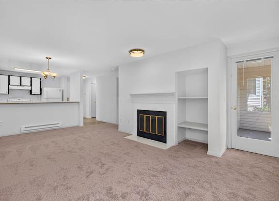 A living room with a fireplace and a television.