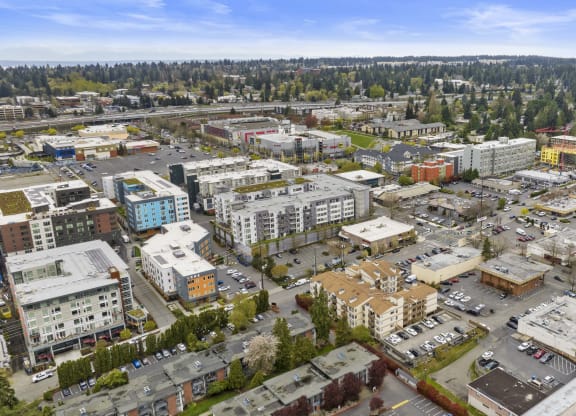 an aerial view of a city with buildings and trees