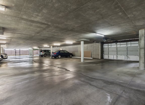 a parking garage with cars parked in it