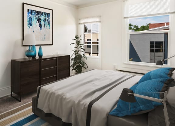 a bedroom with a bed and a window