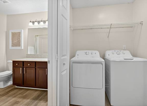 A laundry room with a washer and dryer.