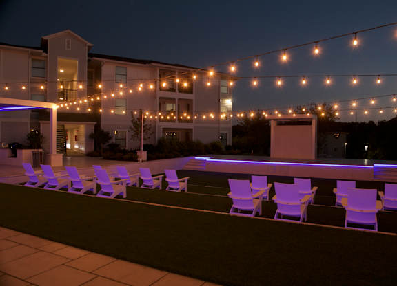 A string of lights is strung across a patio. at The Azul Apartment Homes, Oxford, MS