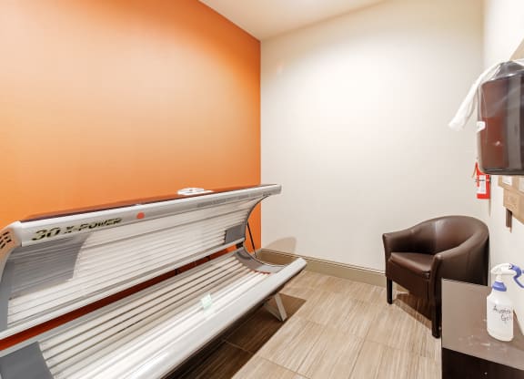 a patient room with a bench and a chair in a hospital room at Cumberland Place Apartment Homes, Texas