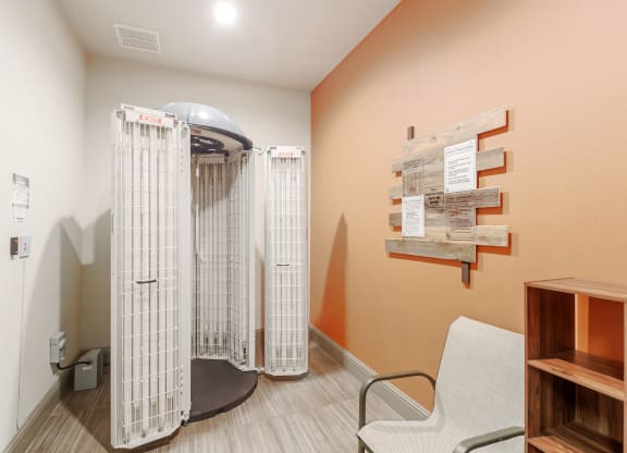 a patient room in a hospital with a shower and a chair at Cumberland Place Apartment Homes, Texas 75703