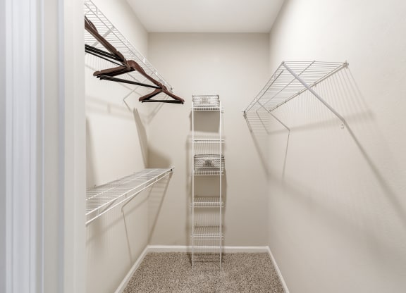 a spacious walk in closet with white walls at Cumberland Place Apartment Homes, Tyler, Texas