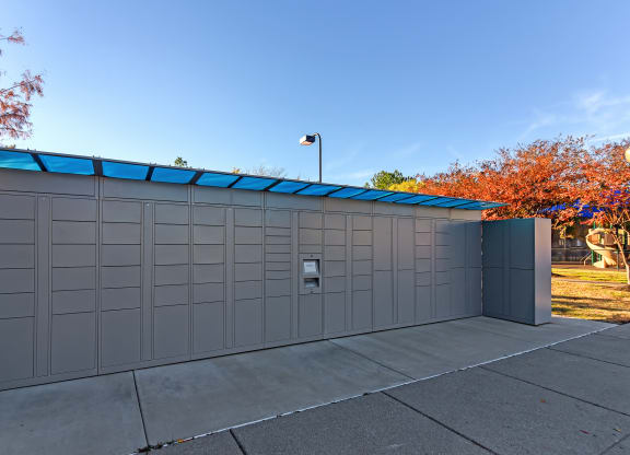 the side of a garage with a blue roof at Cumberland Place Apartment Homes, Tyler 75703