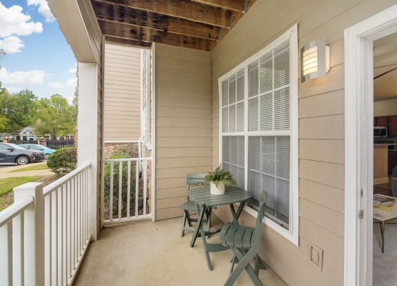 Patio with a table and chairs at Highlands Apartment Homes, Bartlett, TN, Tennessee