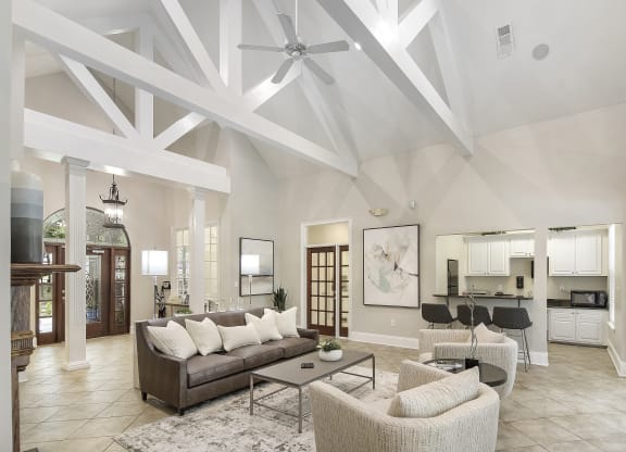 Clubhouse with couch and kitchen at Highlands Apartment Homes, Bartlett, TN, Tennessee , 38135