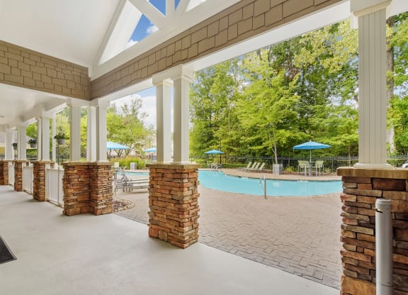 Covered lounge at the community pool at Highlands Apartment Homes, Bartlett