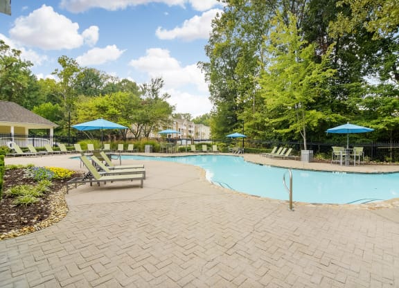 Inviting Swimming pool with chairs at Highlands Apartment Homes, Bartlett