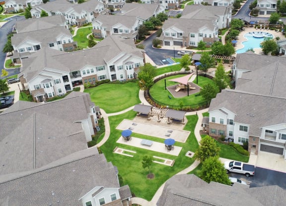 an aerial view of a neighborhood with houses and a fountain at Kingston Crossing Apartment Homes, Bossier City, LA, Louisiana
