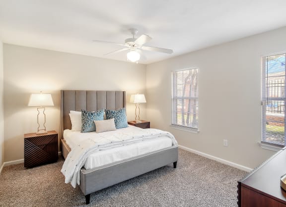 a bedroom with a bed and a ceiling fan at Bridgewater Apartment Homes, Brandon