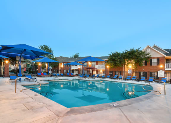 our resort style swimming pool is lit up at night at Bridgewater Apartment Homes, Brandon, 39047