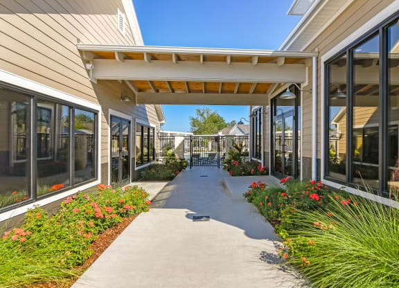 the preserve at ballantyne commons community walkway and patio at Crossgates Apartment Homes, Starkville, MS