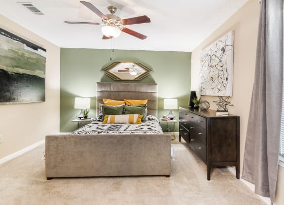 a bedroom with a bed at Crossgates Apartment Homes, Starkville, MS 39759