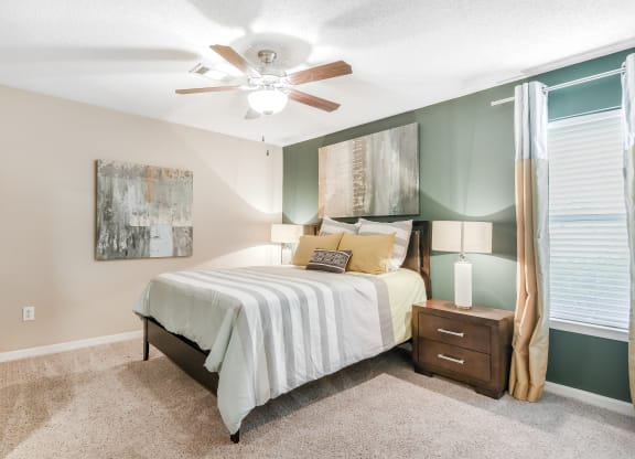 bedroom with ceiling fan at Avalon Apartment Homes in Starkville, MS