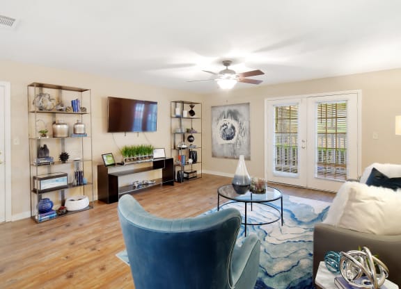 a living room with furniture and a ceiling fan at Lexington Pointe Apartment Homes in Oxford, 38655