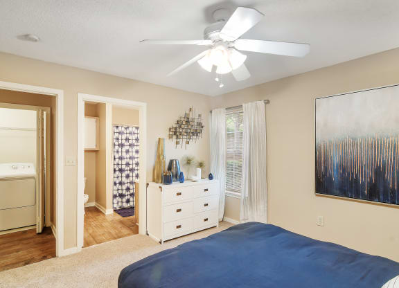 a bedroom with a bed and a ceiling fan at Lexington Pointe Apartment Homes in MS 38655