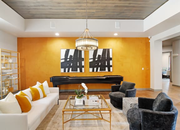 Pool table with sitting area in clubhouse at Faulkner Flats Apartment Homes, Mississippi , 38655