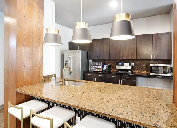 Kitchen with a granite counter top at Faulkner Flats Apartment Homes, Oxford, MS
