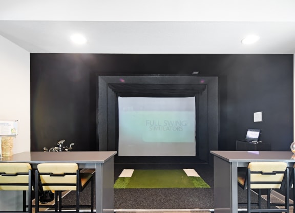 Conference room with a table and chairs and a projector screen at Faulkner Flats Apartment Homes, Mississippi