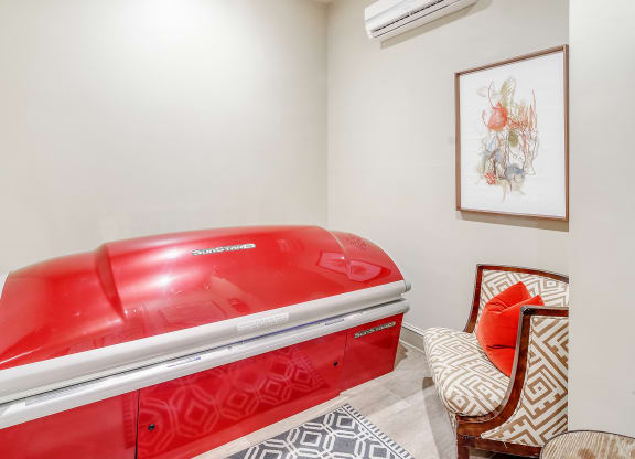 the spa has a red jetted tub in the corner of the room at Cambridge Station Apartment Homes, Mississippi