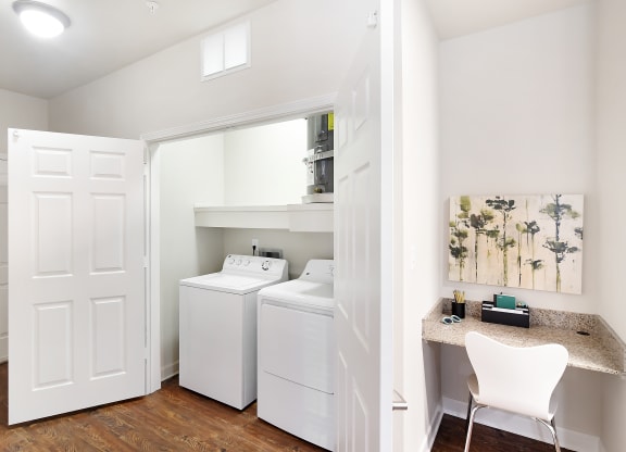 Laundry room with a washer and dryer at Faulkner Flats Apartment Homes, Oxford, MS, 38655