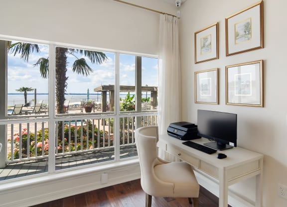 a home office with a desk and a view of the beach at Lakeshore Pointe Apartment Homes, Mississippi, 39047