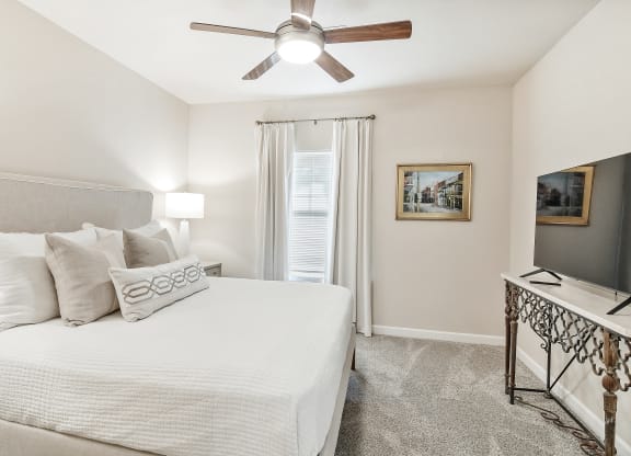 Comfortable Bedroom With Large Window at Faulkner Flats Apartment Homes, Oxford, MS, Mississippi , 38655