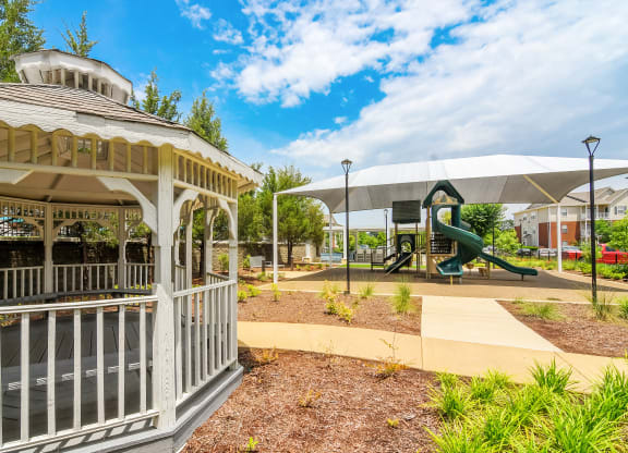 a gazebo with a playground at The Vineyard of Olive Branch Apartment Homes, Olive Branch
