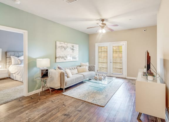 a living room with a couch and a ceiling fan at The Vineyard of Olive Branch Apartment Homes, Olive Branch, 38654