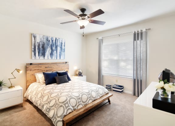 a bedroom with a bed and a ceiling fan at Landing Willow Bayou in Bossier City, LA 