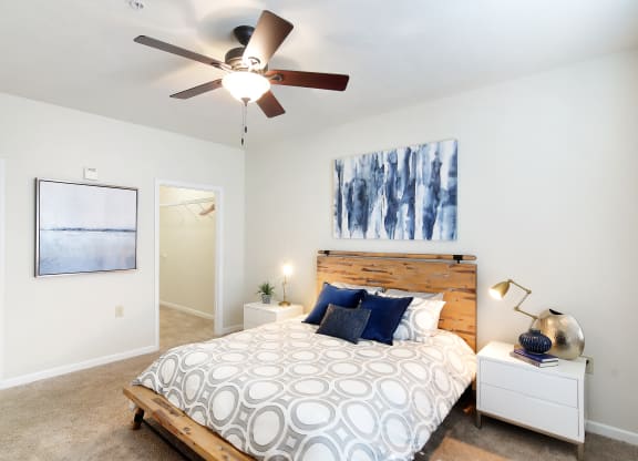 a bedroom with a bed and a ceiling fan at Landing Willow Bayou in Bossier City, LA
