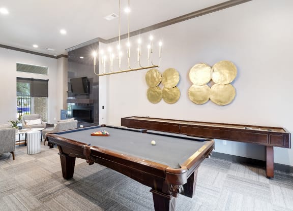 a rec room with a pool table and a tv at Kingston Crossing Apartment Homes, Bossier City