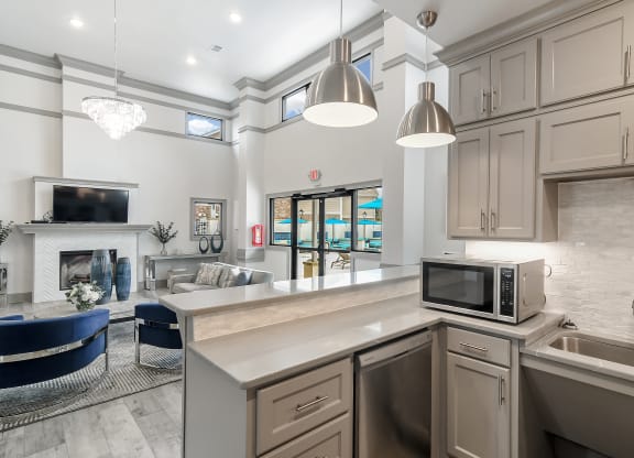 a kitchen with a microwave and a counter top at Parkwest Apartment Homes, Mississippi