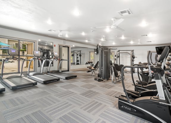 a gym with treadmills and other exercise equipment on the floor at Parkwest Apartment Homes, Mississippi, 39402