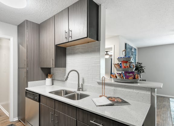 an open kitchen with a sink and a counter top at Parkwest Apartment Homes, Mississippi